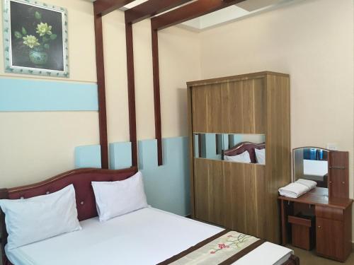 Postel nebo postele na pokoji v ubytování Sunrise Hotel