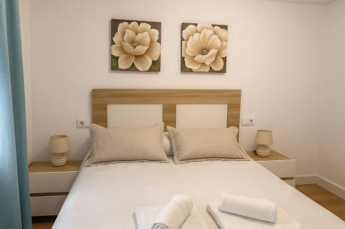 En eller flere senge i et værelse på Alojamiento Baeza- El Limonero A