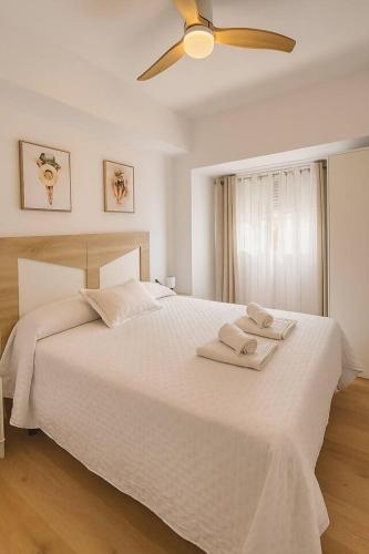 Giường trong phòng chung tại Alojamiento Baeza - Leones 9B