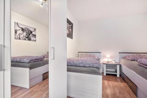 Giường trong phòng chung tại Zum Waldblick