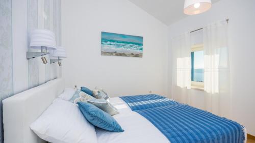 Postel nebo postele na pokoji v ubytování Villa Blue by Villas Guide
