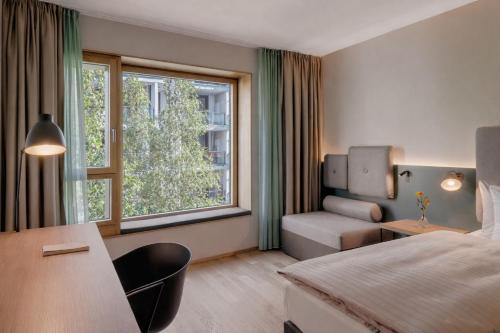 En eller flere senge i et værelse på Hotel the YARD Berlin