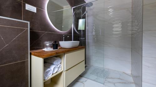 a bathroom with a sink and a mirror at Villa Juma by Villas Guide in Blace