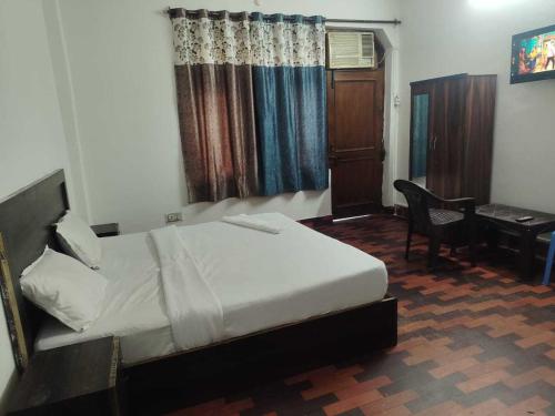 En eller flere senge i et værelse på Hotel O Vip Stay Inn