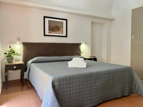 Llit o llits en una habitació de Hotel Fiorenza