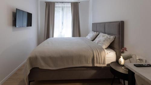 a bedroom with a large bed and a window at Villa D Cube by Villas Guide in Duba