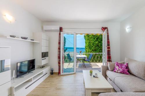 Bezauberndes Apartment nur 240 Meter zum Strand mit Meerblick, Grill, Klima