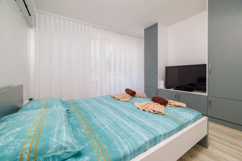 Traumhaftes Apartment direkt an der Strandpromenade mit vielen Palmen