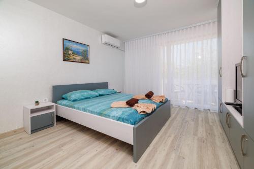 Traumhaftes Apartment direkt an der Strandpromenade mit vielen Palmen