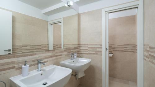 a bathroom with a sink and a mirror at Cypress Paradise by Villas Guide in Dubravka
