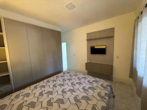 Postel nebo postele na pokoji v ubytování Casa 700m do mar Penha SC