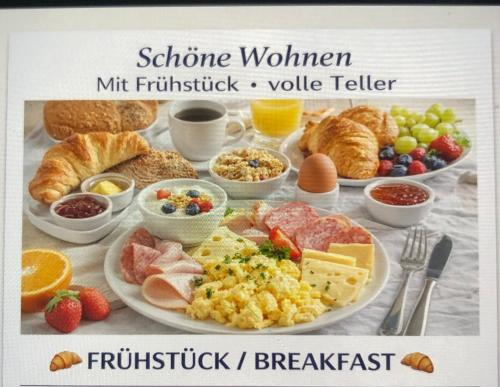 a picture of a breakfast table with breakfast foods at Siegen Zentral Sf in Siegen