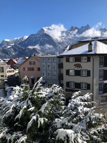 a city covered in snow with mountains in the background at Bad Ragaz Appartement in Bad Ragaz