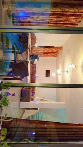 a view of a room through a glass window at Green farm in Al Salt