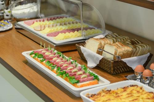 a buffet with different types of food on a table at Kymata Hotel in Naxos Chora