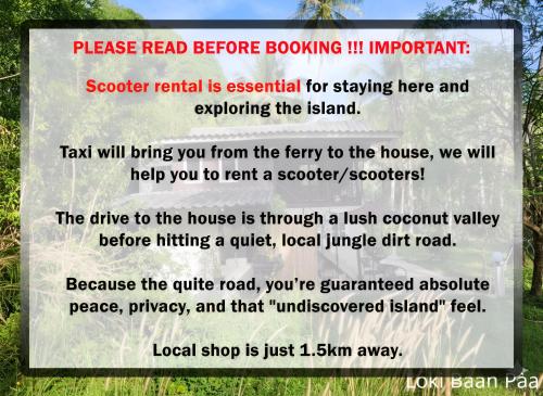 een bord in het midden van een park bij Loki Baan Paa in Ko Kood