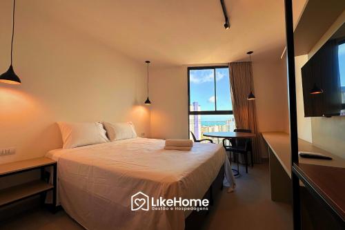 En eller flere senge i et værelse på Solaz Smart Living - LikeHome Hospedagens