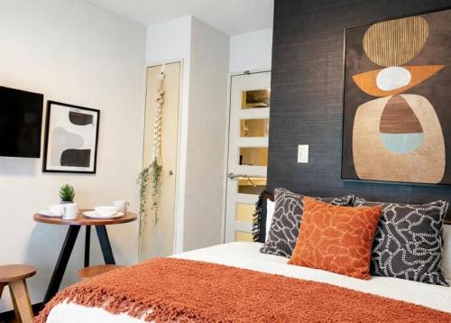 En eller flere senge i et værelse på Hachioji House 201 Apartment