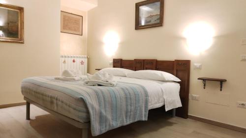 Postel nebo postele na pokoji v ubytování La Suite di San Rufino, 75mq, 2 letti matrimoniali - MyAssisiSuite - Mówimy po polsku