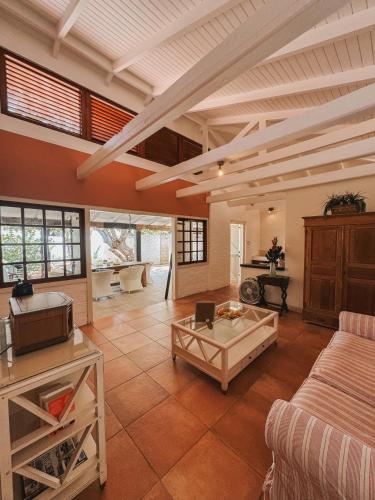 a living room with a couch and a table at Sun Reef Village on Sea in Willemstad