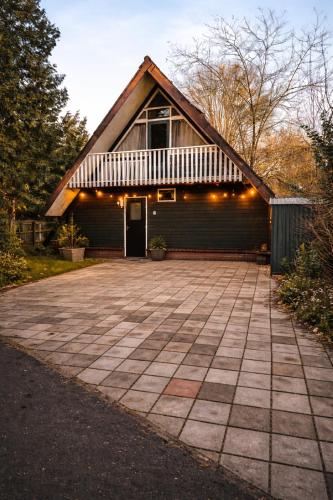 a house with a large driveway in front of it at Lovely house till 9 pers near Amsterdam and the sea in Opmeer