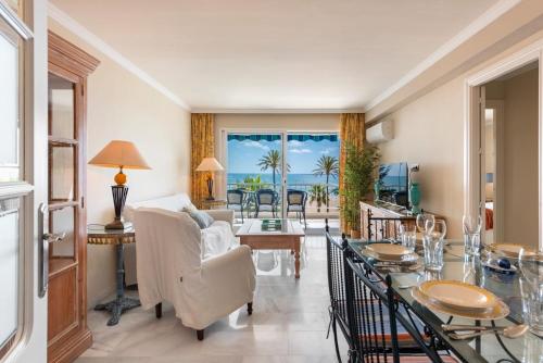 a living room with a view of the ocean at RgHost-Apartamento España en Paseo Marítimo in Málaga