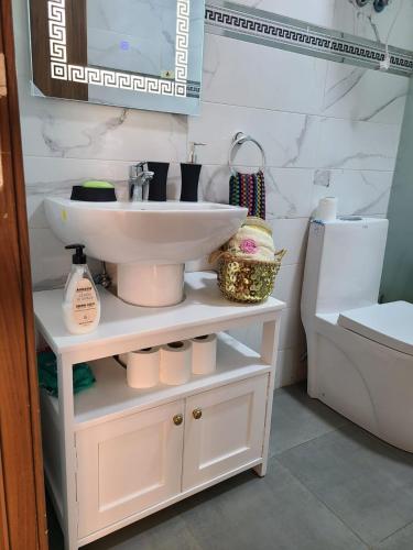 a bathroom with a sink and a toilet at santa barbara in Mansouria