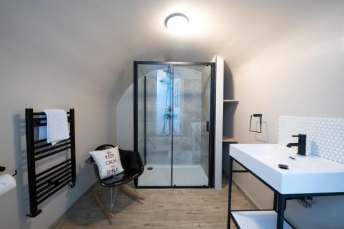 a bathroom with a shower and a sink at 3 Bedroom 2 Bath Serviced Apartment, Hackney & Shoreditch, Sleeps 8 in London