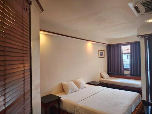 Postel nebo postele na pokoji v ubytování Wonderland Private Chalet at Port Dickson