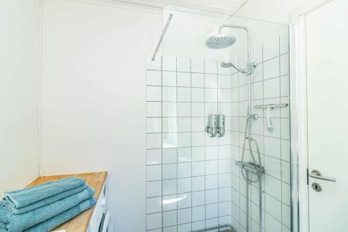 a bathroom with a shower with blue towels at VAR950-Hagfors-Knoaende-13 in Hagfors