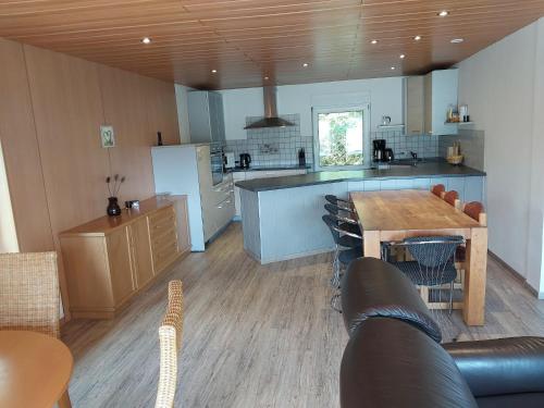 a kitchen with a table and chairs and a counter at Wohnung in Waldnähe in Waltershausen