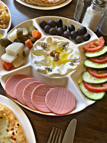 a tray of food with eggs and vegetables on a table at ElMena House Luxor in Luxor