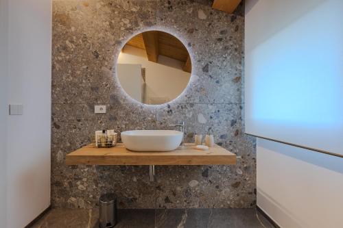 a bathroom with a sink and a mirror at Villa Alice in Montecosaro