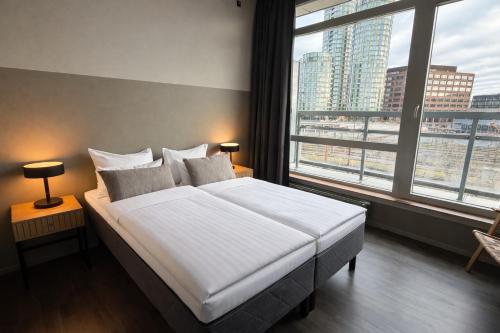 En eller flere senge i et værelse på CPH Hotel