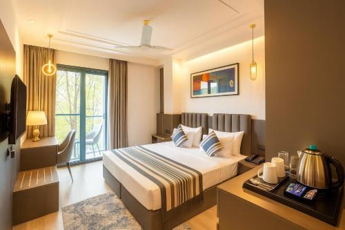 Giường trong phòng chung tại OPO Iffco Chowk, Gurgaon