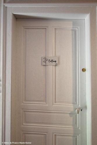 a door with a sign that says city on it at Chambre Coton, Au Fil du Temps in Fougerolles