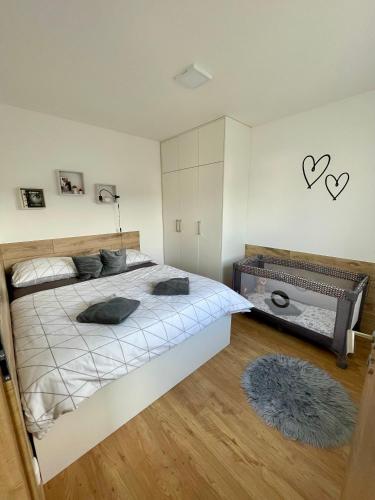 a bedroom with a large bed in a room at Domeček Jasná in Jeseník