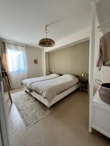 Llit o llits en una habitació de Maison Morrivelle