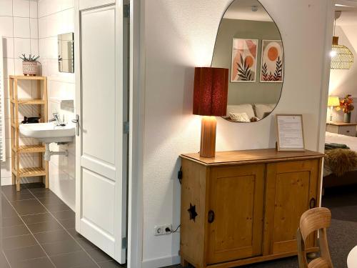 a bathroom with a sink and a mirror at Verblijf bij Bynt in Sneek