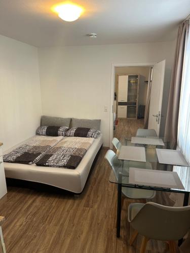 En eller flere senge i et værelse på Wohnung in Sankt Englmar Nr 415