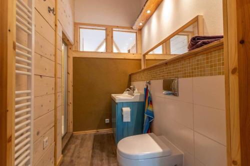 a small bathroom with a toilet and a sink at KRO845-Lessebo-Vedamala-14 in Ljuder