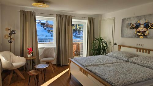 a bedroom with a bed and a window at SCHWEIZER Hof in Tamsweg