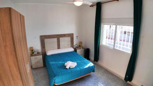 En eller flere senge i et værelse på Apartalux Luna Carboneras