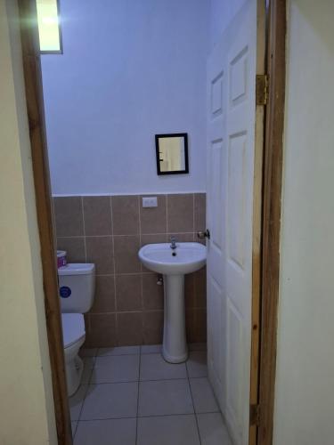 a bathroom with a sink and a toilet at Casa Nicañol in La Virgen