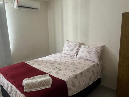 a small bed in a small room with at Cantinho do Sossego in João Pessoa