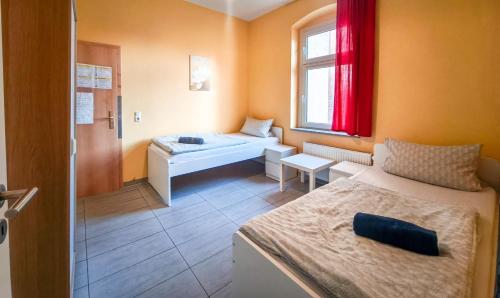 En eller flere senge i et værelse på VS Workers Apartment T1-6