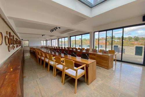 a lecture hall with a long row of chairs and desks at Ricefield Valley in Mandriankeniheny