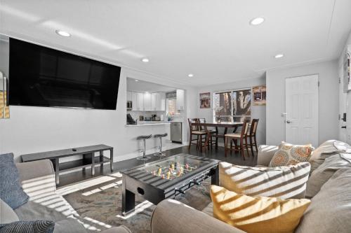 a living room with a couch and a tv at Golfers Dream! Sweet NW location. in Arvada