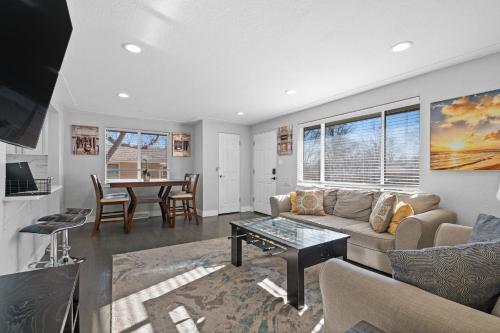 a living room with a couch and a table at Golfers Dream! Sweet NW location. in Arvada