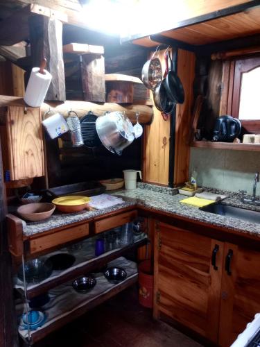 a kitchen with a sink and a counter top at Cabaña Alcione in Capilla del Monte
